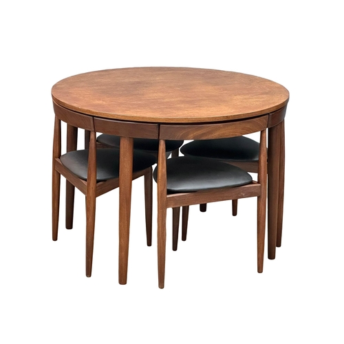 1 - Hans Olsen for Frem Rojle. A Danish Mid Century teak “Roundette” dining table and 4 chairs. Designed... 