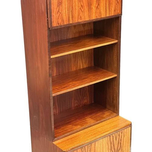 117 - A Danish Mid Century rosewood bookshelf with 2 cabinet doors. 61x44x187.5cm. (1)