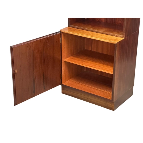 117 - A Danish Mid Century rosewood bookshelf with 2 cabinet doors. 61x44x187.5cm. (1)