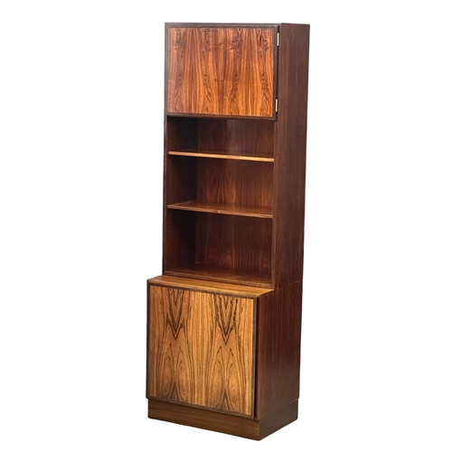 117 - A Danish Mid Century rosewood bookshelf with 2 cabinet doors. 61x44x187.5cm. (1)