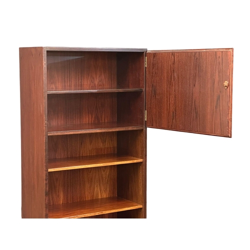 117 - A Danish Mid Century rosewood bookshelf with 2 cabinet doors. 61x44x187.5cm. (1)