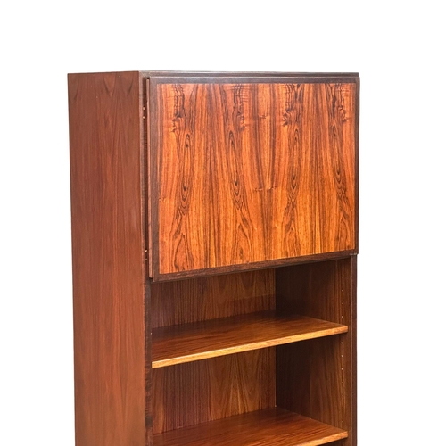 117 - A Danish Mid Century rosewood bookshelf with 2 cabinet doors. 61x44x187.5cm. (1)