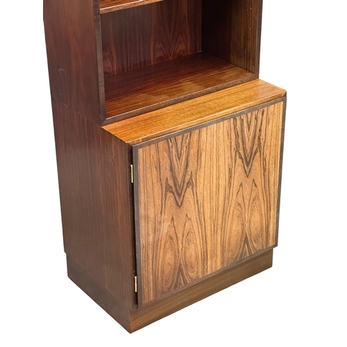 117 - A Danish Mid Century rosewood bookshelf with 2 cabinet doors. 61x44x187.5cm. (1)