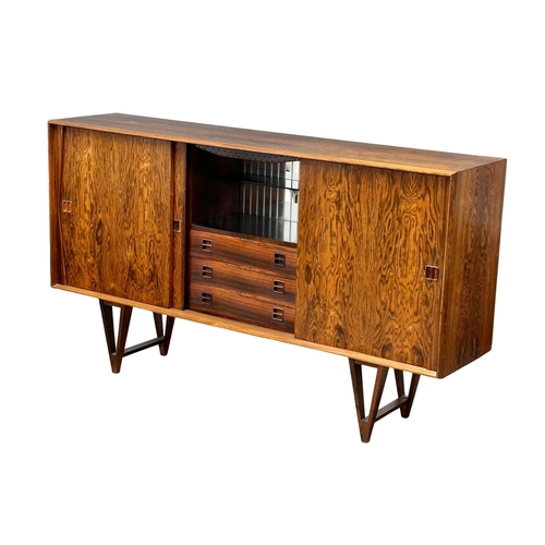 12 - Helge Vestergaard Jensen. A rare Danish Mid Century rosewood sideboard credenza. Designed by Helge V... 