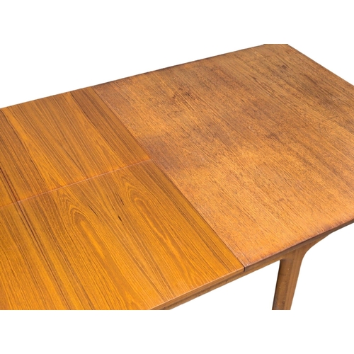 141 - A McIntosh Mid Century teak extending dining table designed by Tom Robertson. 236x91.5x74cm extended... 