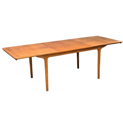 141 - A McIntosh Mid Century teak extending dining table designed by Tom Robertson. 236x91.5x74cm extended... 