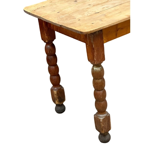 157 - A 19th Century Victorian pine farmhouse kitchen table with bobbin turn legs. 162x65x75cm(2)