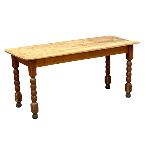 157 - A 19th Century Victorian pine farmhouse kitchen table with bobbin turn legs. 162x65x75cm(2)