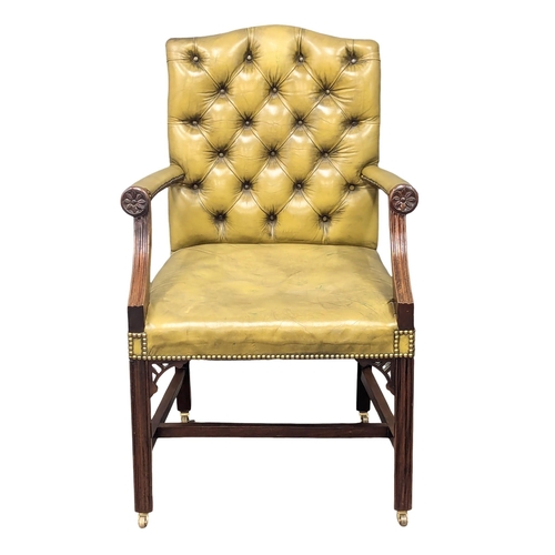 20 - A good quality 18th Century style deep button back leather Gainsborough style elbow chair.