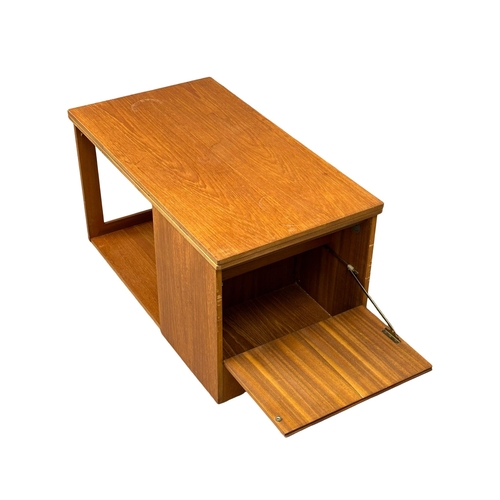 222 - A McIntosh Mid Century teak “Tristor” table. With 2 nesting table and turnover top.