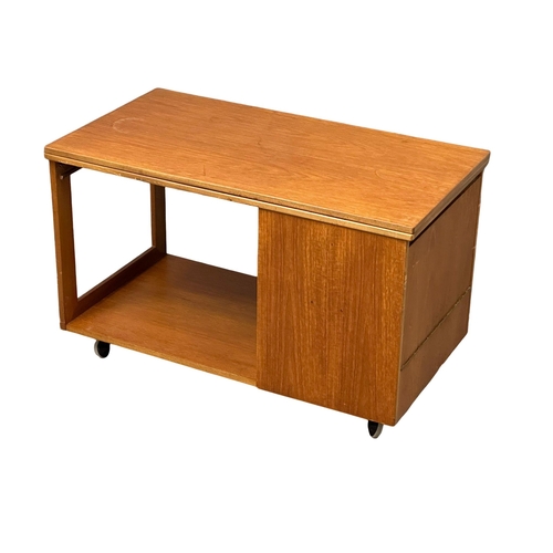 222 - A McIntosh Mid Century teak “Tristor” table. With 2 nesting table and turnover top.