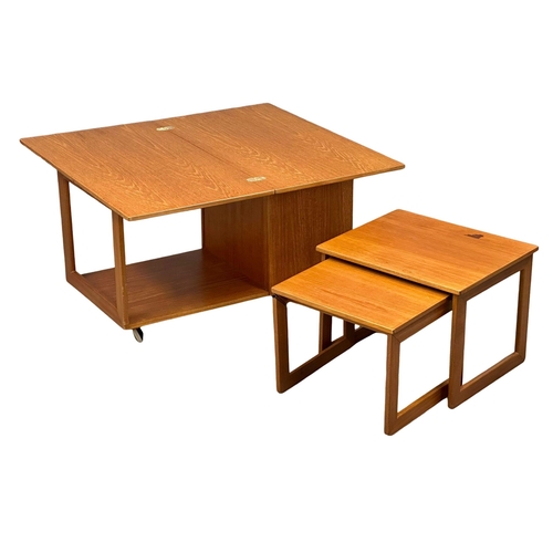 222 - A McIntosh Mid Century teak “Tristor” table. With 2 nesting table and turnover top.