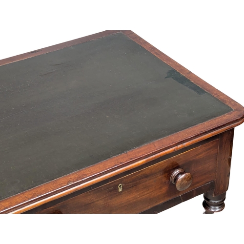 287 - A 19th Century Early Victorian mahogany writing table with 2 drawers on turned legs. Circa 1840s. 11... 