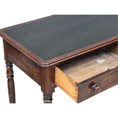 287 - A 19th Century Early Victorian mahogany writing table with 2 drawers on turned legs. Circa 1840s. 11... 