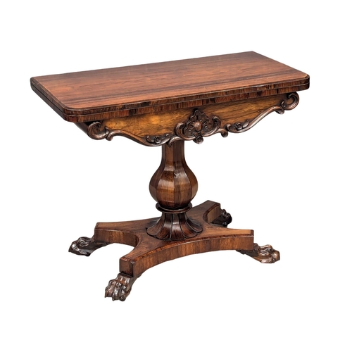 305 - A good quality William IV rosewood games table on baluster turned column and lion paw feet. Circa 18... 