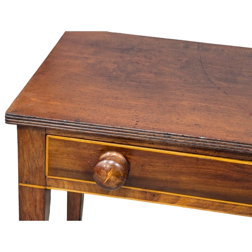 310 - A George III inlaid mahogany side table. Circa 1800. 89x39x72cm (3)