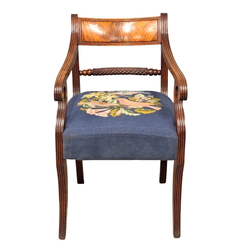 370 - An Early 19th Century Regency Period mahogany armchair with tapestry seat on Sabre legs. (3)