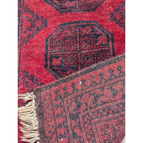 441 - A vintage 'Kayam' Afghan hand knotted rug. 74x150cm (4)