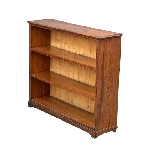 520C - A 19th Century Victorian pine open bookcase. 126x33x106cm (2)