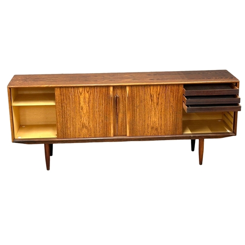 5A - Gunni Omman for Axel Christensen Odder.  A Danish Mid Century rosewood sideboard. Designed by Gunni ... 