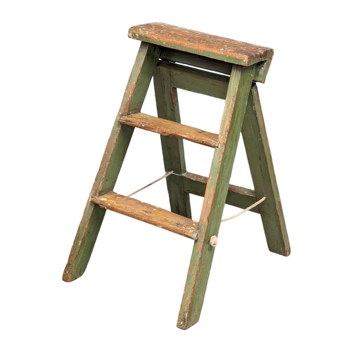 A small Early 20th Century pine step ladder with original paint.