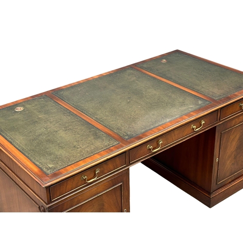 73 - A large Georgian style mahogany pedestal writing desk with leather top. 167.5x87x76cm.(4)