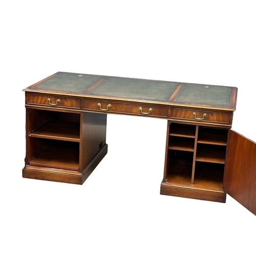 73 - A large Georgian style mahogany pedestal writing desk with leather top. 167.5x87x76cm.(4)