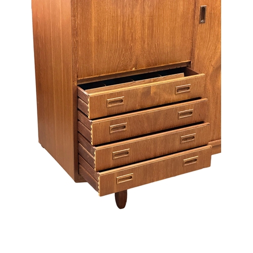 146 - A Mid Century teak cocktail sideboard. 183x46x114.5cm(5)