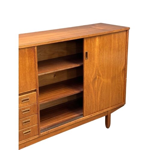 146 - A Mid Century teak cocktail sideboard. 183x46x114.5cm(5)