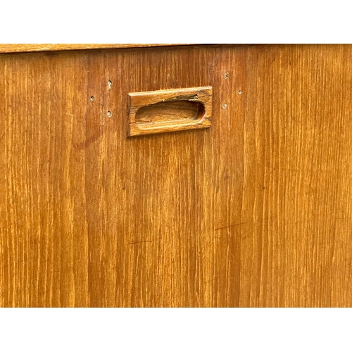 146 - A Mid Century teak cocktail sideboard. 183x46x114.5cm(5)