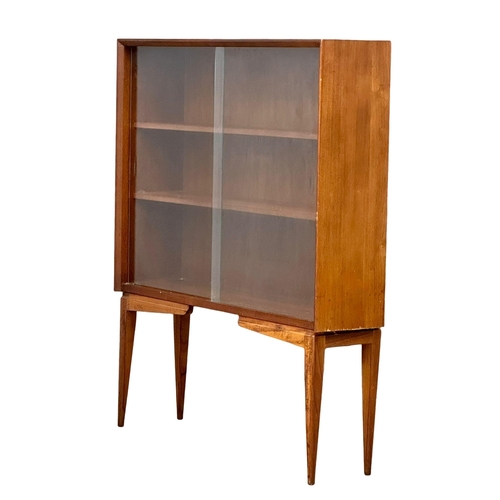 175 - A Mid Century teak bookcase by Herbert Gibbs. 91x24.5x116cm(5)