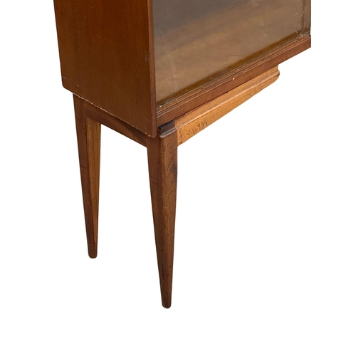 175 - A Mid Century teak bookcase by Herbert Gibbs. 91x24.5x116cm(5)