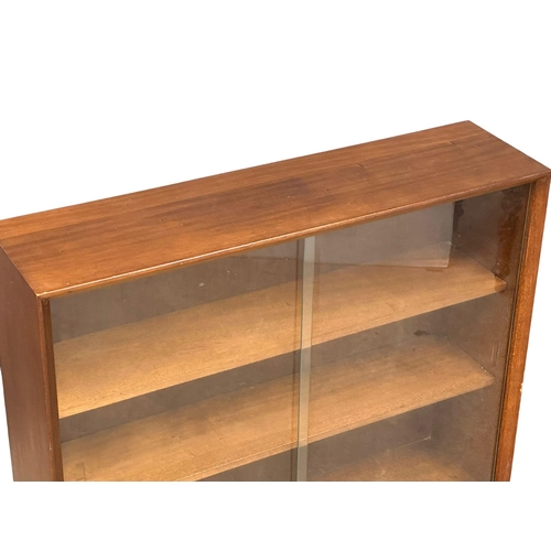 175 - A Mid Century teak bookcase by Herbert Gibbs. 91x24.5x116cm(5)