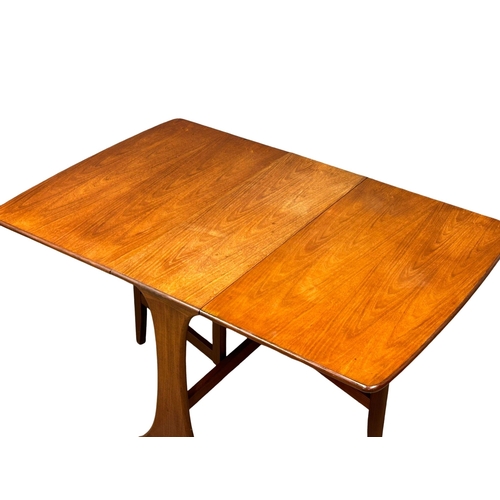 187 - A G-Plan “Fresco” Mid Century teak drop leaf dining table. Open 137x91.5x73cm.(4)