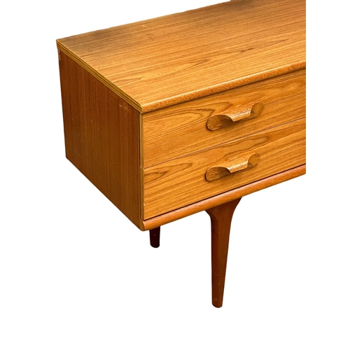 189 - Frank Guille. A Mid Century teak sideboard. Designed by Frank Guille for Austinsuite. 152x43x70cm