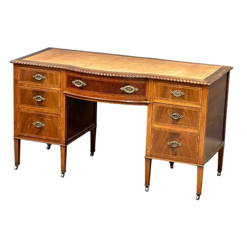 195 - A large Early 20th Century Sheraton Revival inlaid mahogany writing desk with leather top. Circa 190... 