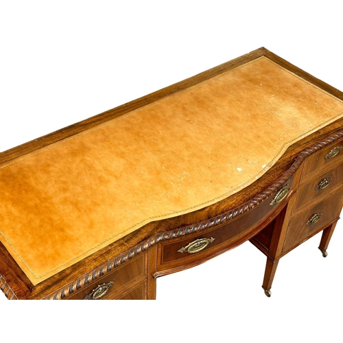 195 - A large Early 20th Century Sheraton Revival inlaid mahogany writing desk with leather top. Circa 190... 