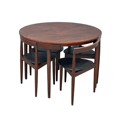 1A - Hans Olsen for Frem Rojle. A Danish Mid Century teak “Roundette” dining table and 4 chairs. Designed... 