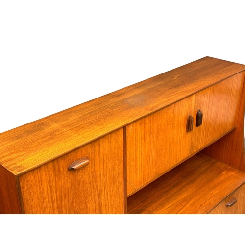 22 - A G-Plan “Brasilia” Mid Century teak highboard cocktail sideboard. 153x43.5x136cm (5)