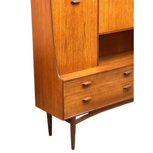 22 - A G-Plan “Brasilia” Mid Century teak highboard cocktail sideboard. 153x43.5x136cm (5)