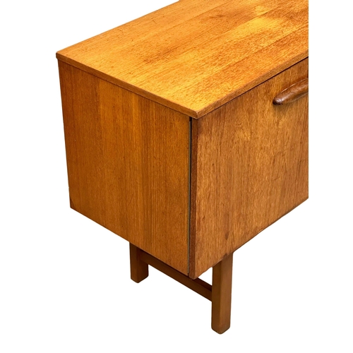 296 - A 1960’s Mid Century teak sideboard. 135x41x74cm(3)