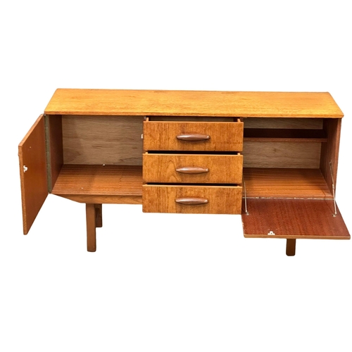 296 - A 1960’s Mid Century teak sideboard. 135x41x74cm(3)