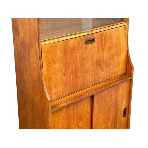 374 - A 1960’s Mid Century teak fall front bureau bookcase. 76x30.5x146.5cm(4)