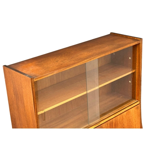 374 - A 1960’s Mid Century teak fall front bureau bookcase. 76x30.5x146.5cm(4)