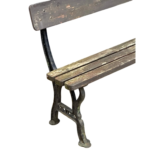 413 - A Late Victorian cast iron garden bench with wooden straps. 183cm. (5)