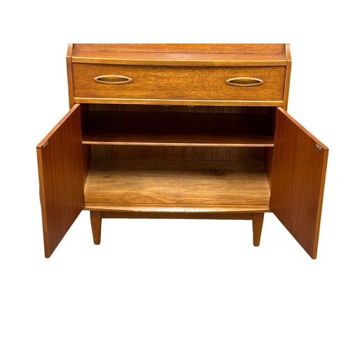 43 - A Mid Century teak writing bureau by Jentique. 1960’s. 75.5x40.5x107cm(4)