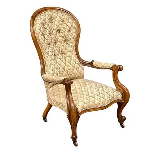 437 - A Mid 19th Century Victorian mahogany open armchair on cabriole legs. Circa 1860.(10)