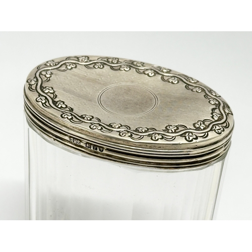 588 - R. Wallace & Sons. Levi & Salaman. 2 silver lidded glass jars. Early 20th Century. 7x9cm. 3x2.5cm (2... 