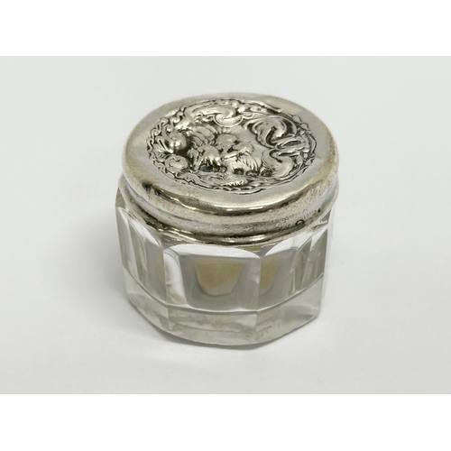 588 - R. Wallace & Sons. Levi & Salaman. 2 silver lidded glass jars. Early 20th Century. 7x9cm. 3x2.5cm (2... 