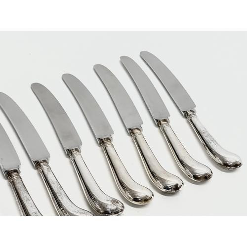 591 - A set of 12 Late 20th Century silver pistol handled table knives. JB. Sheffield 1985. 21cm  (4)